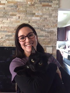 Sarah Tremblay holding a black cat